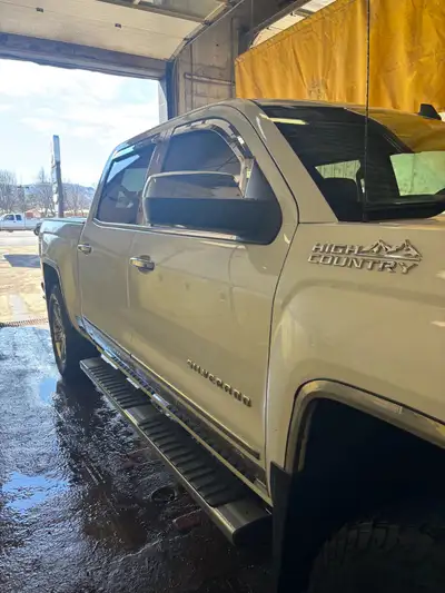 This luxury white pearl white Chevy high country stands out ride like a boss heated seats coolant se...