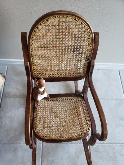 Child size Wooden Bentwood style Rocking Chair with caned back.