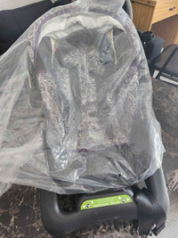 Baby car seat slightly used still in a plastic looks brand new.