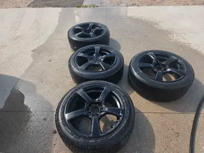 These are Touren rims with winter tires, sized at 225/50R18, offering both style and performance for...