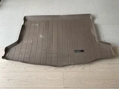 1 year old tan WeatherTech trunk liner for 2012-2016 Subaru Impreza 5dr (hatchback) model. The liner...