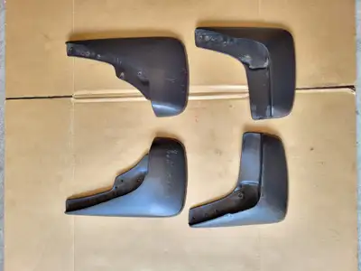 Set of 4 OEM mud flaps from my 2002 Chrysler 300m. Flaps are in good condition and an exact fit for...