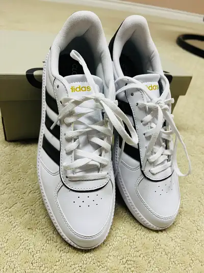 Step up your shoe game with these Adidas Court sneakers, perfect for adding a sporty touch to any ou...