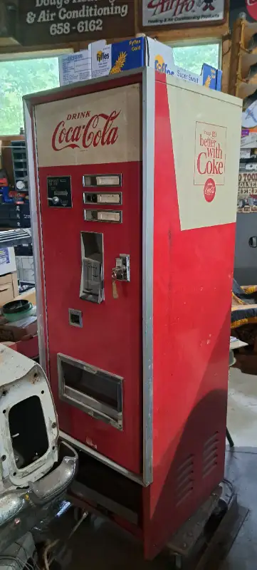 Nice old upright Coke vending machine with all the keys! It's in great working condition. It's 22 in...