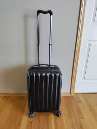 Ricardo Carry on Rolling Luggage for sale. Extendable and has USB port. Color: black Size: 9" X 14"...