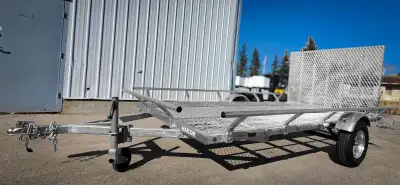 Rear loading ramp adjusts to 3 different angles Heavy duty A frame tongue Steel mesh flooring along...