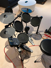 Electric drum kit, amp and stool - excellent condition.