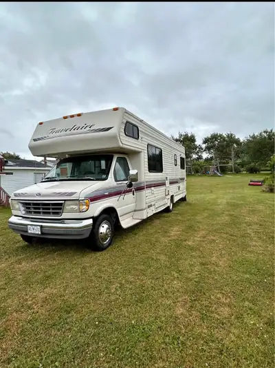 Take a trip back in time with this 1993 Ford Econoline Travelaire motorhome, a vintage gem ready for...