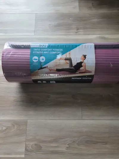Selling a brand new Decathlon Domyos 500 Comfort Fitness Mat in a nice mauve color. It is still unus...