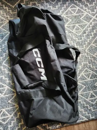 New, never used. Black CCM bag.