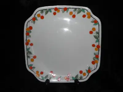 This is a bone china salad plate, in Royal Doulton’s “Mountain Ash” Art Deco pattern. It is 8 1/8” s...