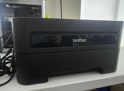 This is a used Brother HL-2270DW wireless black and white laser printer that delivers efficient and...