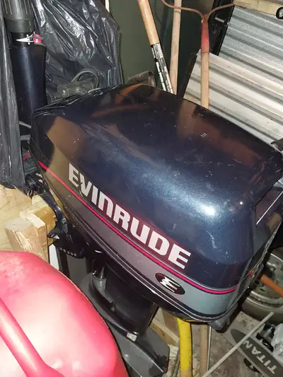 15 Hp 2 stroke motor for sale in good condition. comes with tank and some accessories and wooden sta...
