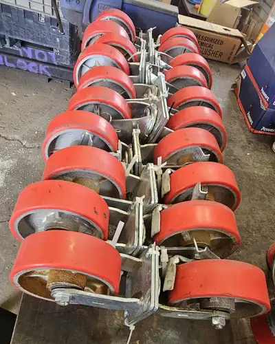 Heavy-duty swivel caster wheels with red polyurethane tread, steel core, and mounting plate, 6-inch...