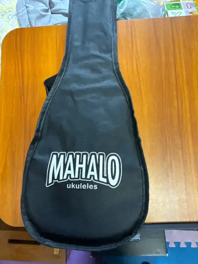 Get ready to strum your way to happiness with this charming Mahalo Ukulele, perfect for beginners an...