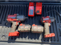 Milwaukee 3/8"  and 1/2" impact guns, two batteries and charger