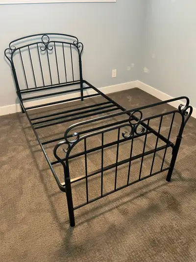 Metal bedframe. Black powder coated. Twin size. All hardware included. If the ad is posted, then the...