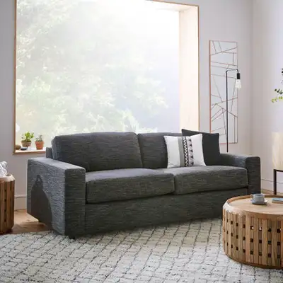 This is an EQ3 charcoal grey couch that easily converts into a modern pull-out sofa bed, perfect for...