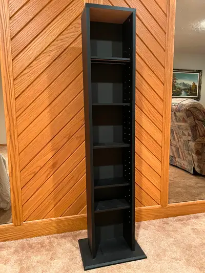 Adjustable / removable seven shelf unit in black. Unit is 51.5 inches tall. Base of unit is 14 in wi...