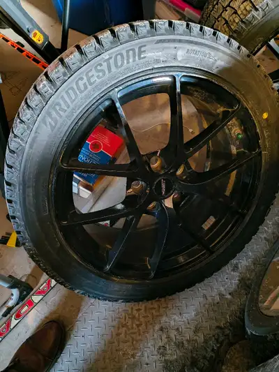 Set of four 'like new' no scratches Fast rims and 2 week used winter tires. The set is like new beca...