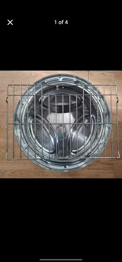 Fire pit with 1/4" thick grill from upcycled stainless steel washer drum and oven grill with solid s...