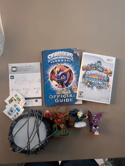 Skylanders Giants Starter Pack for Nintendo Wii, complete with Spyro's Adventure Official Guide.
