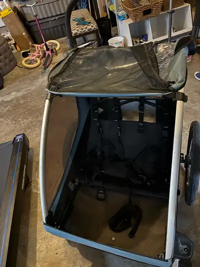 Thule stroller/bike trailer in good condition. Could use a hose down but otherwise good shape. Some...