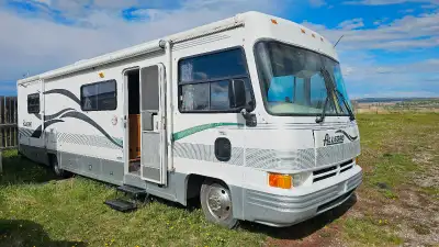 1998 Chevy P30 Motorhome for sale. Active status. 32' long with slideout Has a onan Marquis 7000 gen...