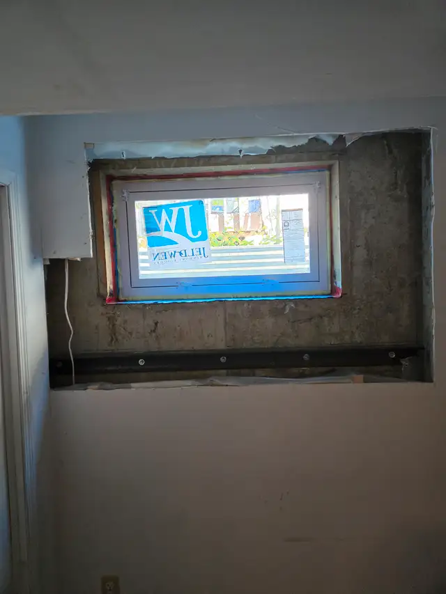 Egress window cutting & concrete work63234701761027124