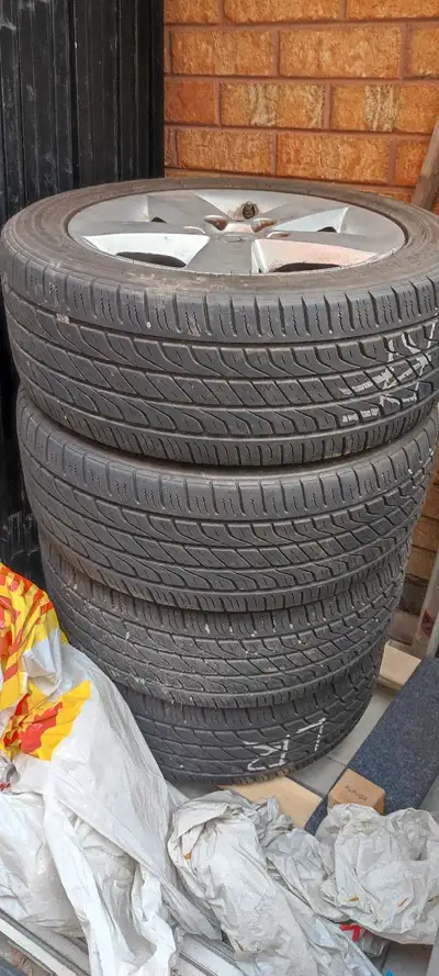 205/55/16 All season tires on Honda alloy rims. Asking for $400.