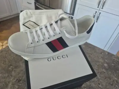 Brand new Gucci Sneakers. Never worn. Negotiable, no low ballers.