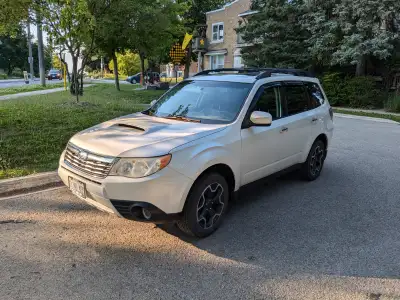 This is fun-to-drive Forester with hood scoop and turbo. Includes all-season and winter tires on rim...