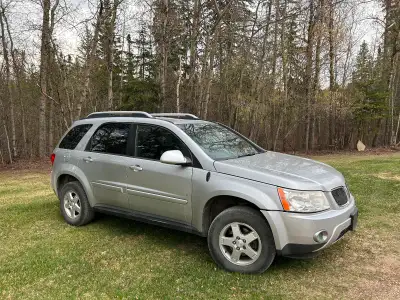 I am selling a silver 2006 Pontiac Torrent. It needs a new windshield and the AC may need to be rech...