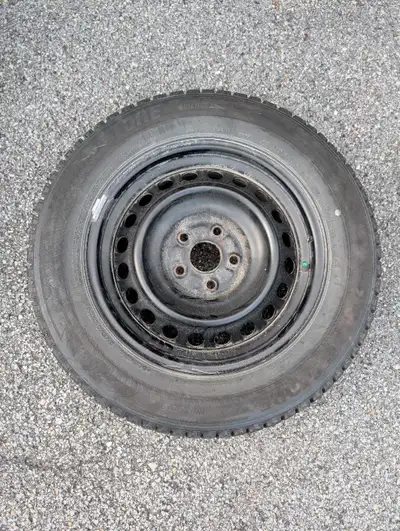These Bridgestone 205/65R16 95T winter tires are mounted on steel rims and are in good, pre-owned co...