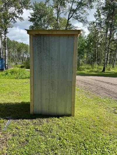 Wood shed 4ft wide 46 inches deep 8 ft tall Used Galvanized and black tin, $400.00