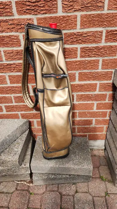 Golf bag and 3 clubs, View more