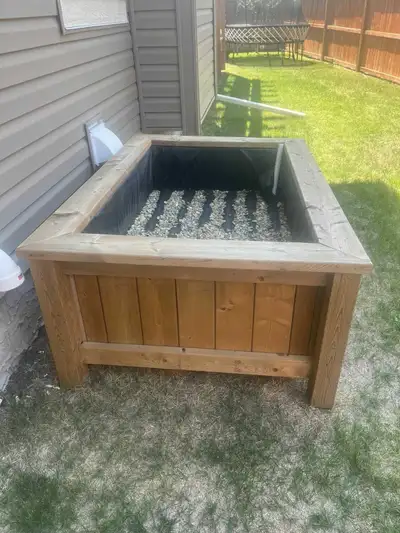 This beautiful garden bed is lined with a pond liner and has weeping tile to hold water. Just add to...