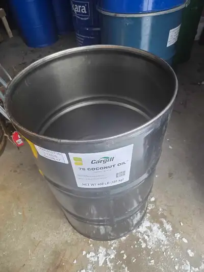 Steel drum for storage of liquid, international shipping, barque stand making, making an outdoor ove...