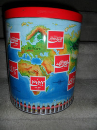 Coke World Popcorn Tin. $20. New condition. 11 1/2"H x10"across.