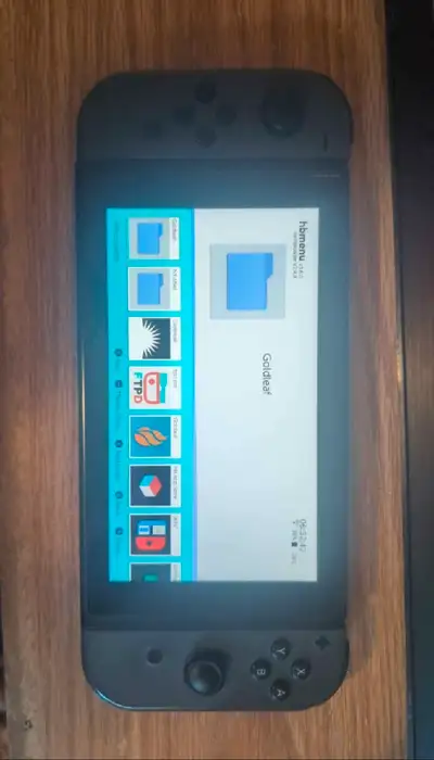 Nintendo switch modded with charger and a case, View more