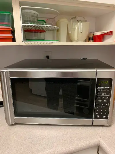 Large 1.1 cu.ft microwave oven in great condition but too big for my counter space. $90.