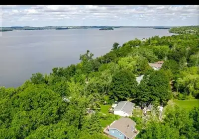Cottage with Sunroom, Bunkie and Trailer in Roseneath on Rice Lake on your own land with a dock. Hou...