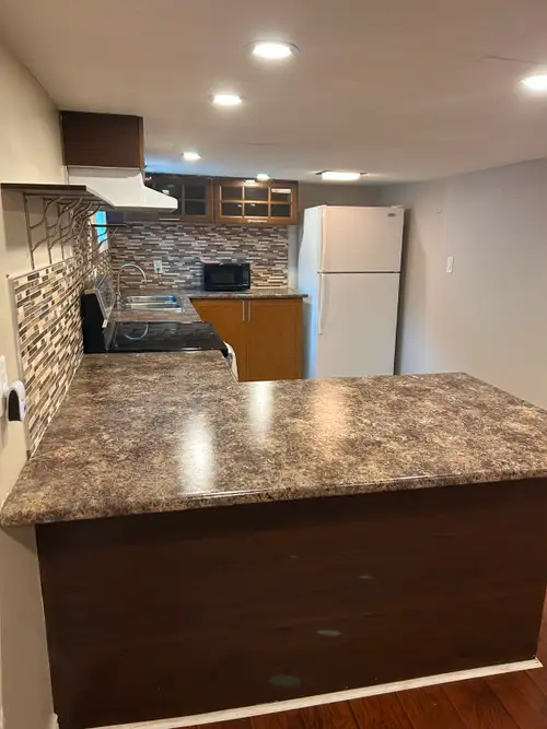 Large basement unit 1 bed + den, heat hydro, water included. available now or July 1. Shared laundry...