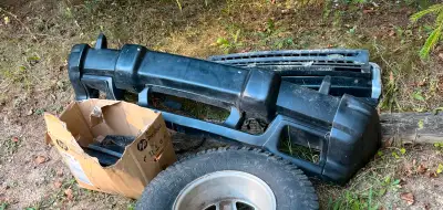 Rare and complete bumper assembly from a 2002-2004 model. In good condition with no cracks.