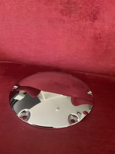 Enhance your Harley Davidson with this shiny chrome derby cover! This used cover is off a 2015 XL120...