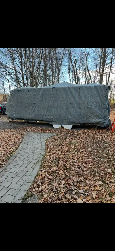 Gold Shield RV cover. Fits 24ft -27ft trailer. Purchased late last November. Regular price was $1299...