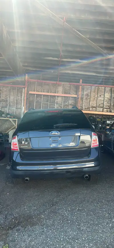 This is a Ford Edge that is available for sale. The odometer reads 218593 miles. The car is in used...