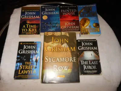 Seven John Grisham book (one first edition)., View more