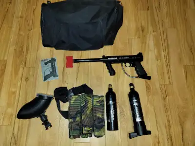 Tippmann 98 Custom paintball marker in excellent condition. Includes original manual, two CO2 canist...