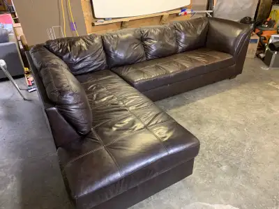 Extra large Ashley genuine leather sectional Dimensions are 120” by 85” Comes apart, bottom cushions...